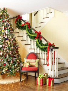 Garland hung on the banister with velvet ribbon  Velvet christmas bow,  Magnolia leaf garland, Christmas banister