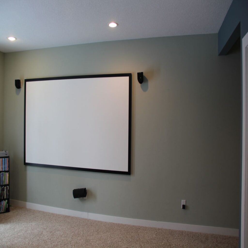 Before Photo: Projector screen on wall